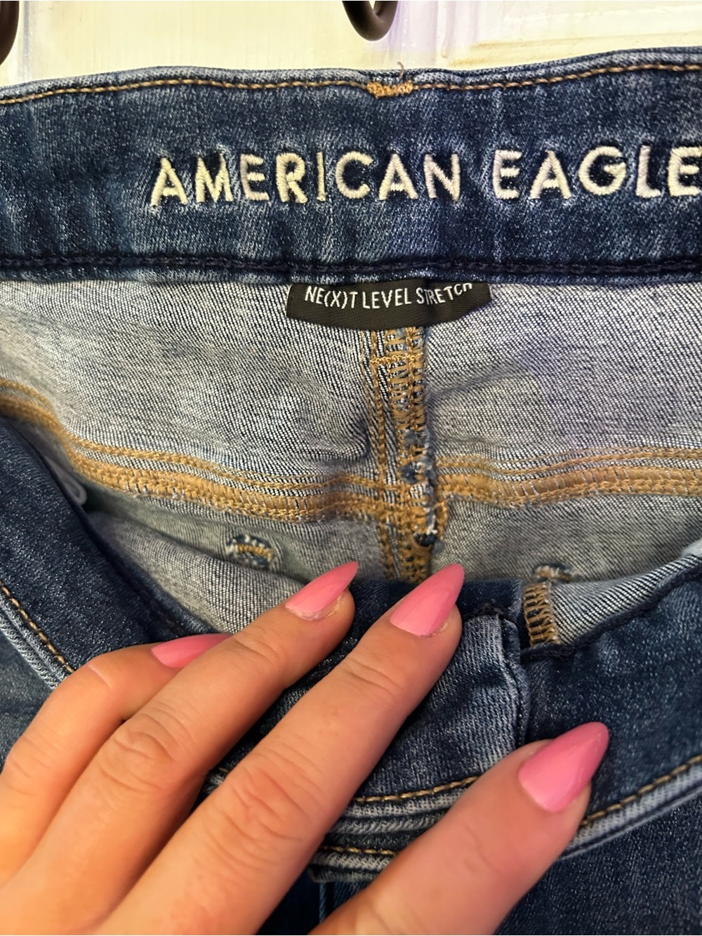 American Eagle Outfitters Women's Blue Skinny Jeans with Pink Nail Accent